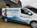 Clear vision services car parked outside house